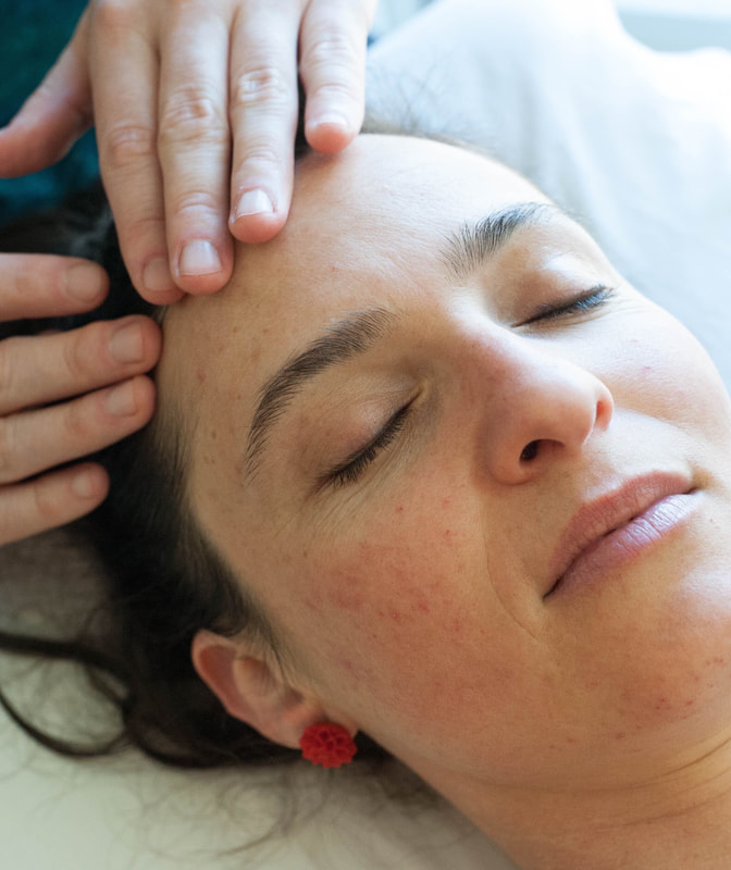 Image shows acupuncturist using teishin on patient's face.